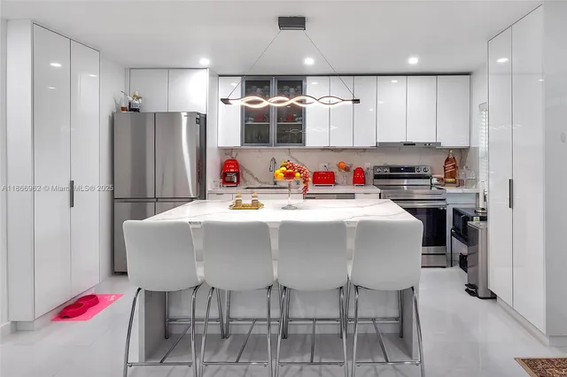 a view of a deck with table and chairs with wooden floor