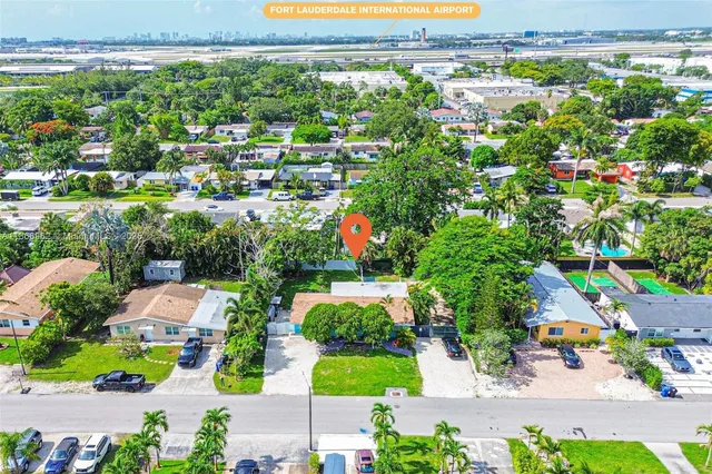 a view of a park with large trees