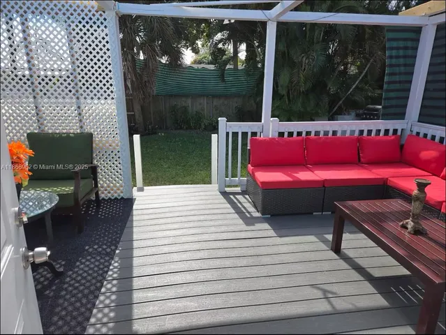 a kitchen with stainless steel appliances granite countertop a kitchen island a table and chairs