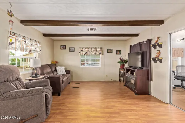 a view of a dining room with furniture window and wooden floor