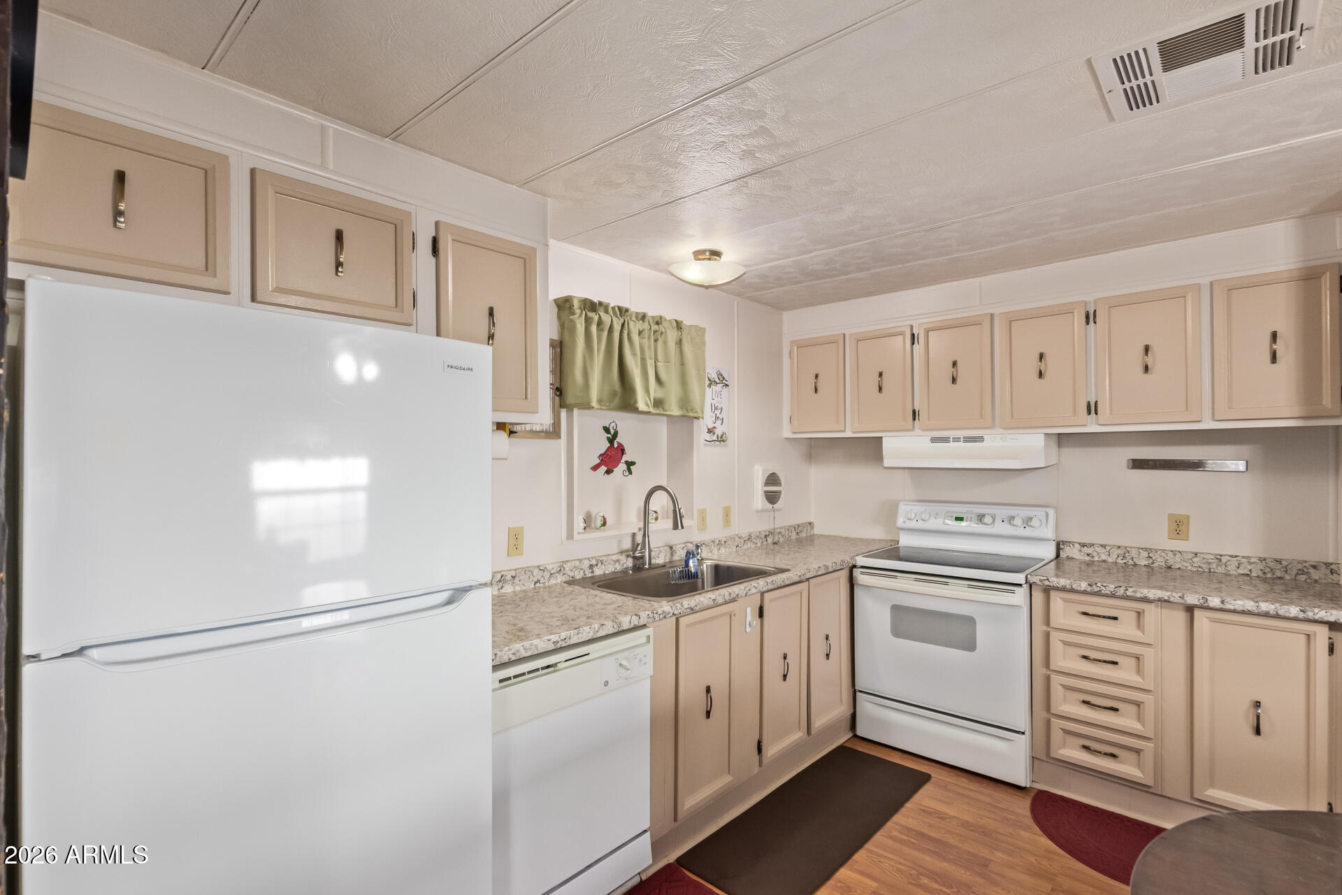 201 South Greenfield Road, Unit 291 Mesa, AZ 85206 - Photo 14 of 34 a kitchen with granite countertop cabinets and white appliances