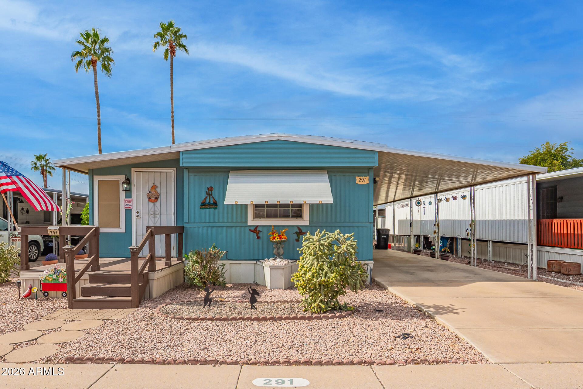201 South Greenfield Road, Unit 291 Mesa, AZ 85206 - Photo 2 of 34 a front view of a house with garden