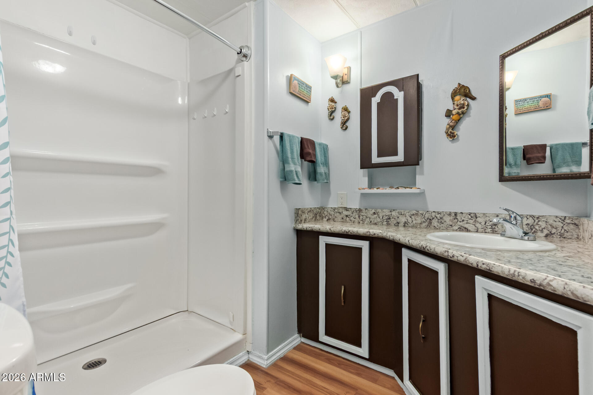 201 South Greenfield Road, Unit 291 Mesa, AZ 85206 - Photo 22 of 34 a bathroom with a granite countertop sink a mirror and a bathtub