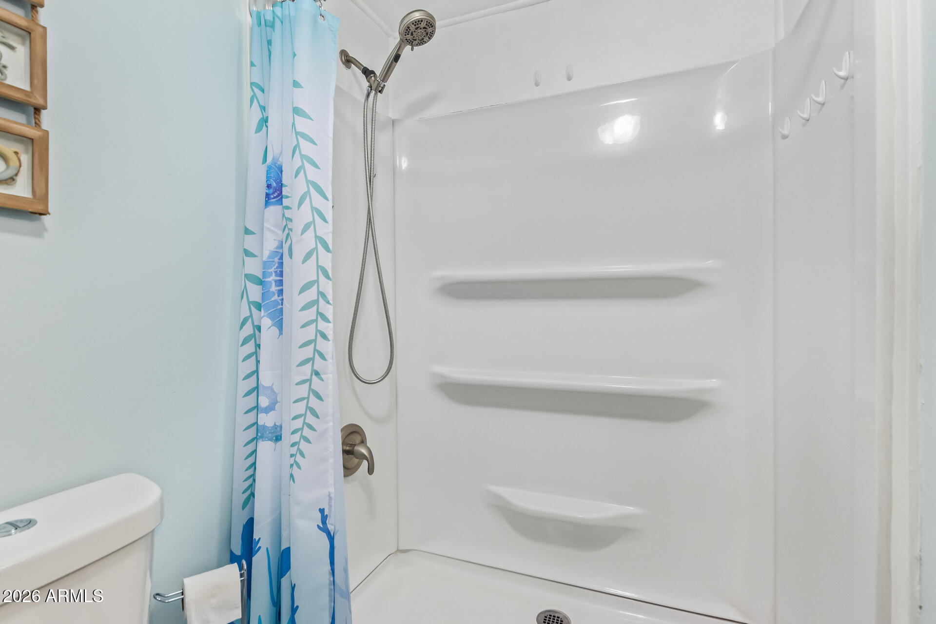 201 South Greenfield Road, Unit 291 Mesa, AZ 85206 - Photo 23 of 34 a bathroom with a shower curtain
