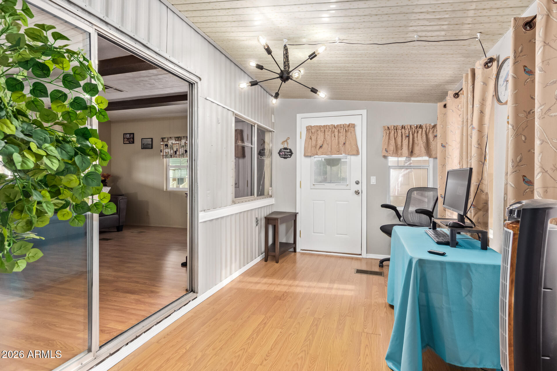 201 South Greenfield Road, Unit 291 Mesa, AZ 85206 - Photo 27 of 34 a view of a livingroom with a flat screen tv
