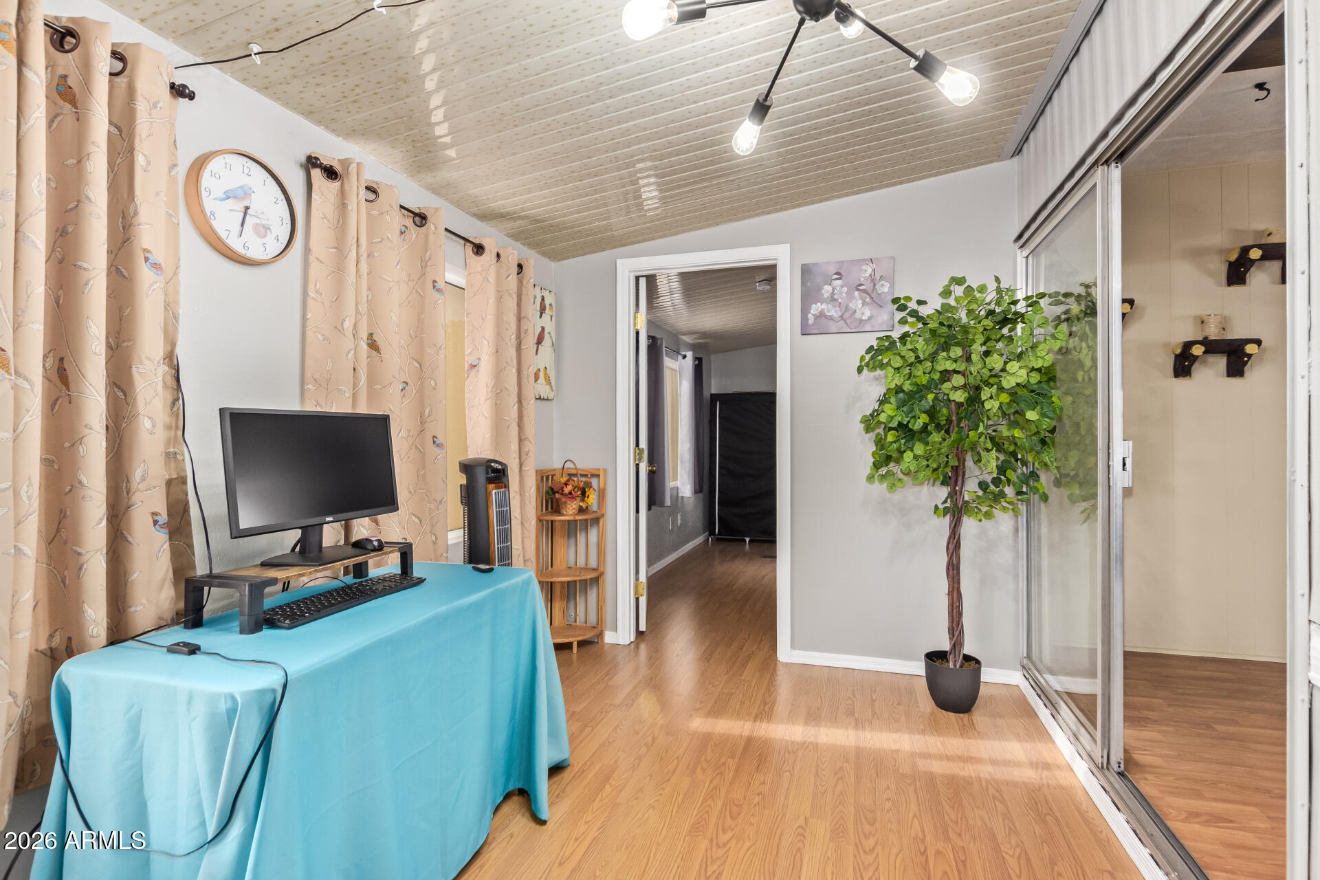 201 South Greenfield Road, Unit 291 Mesa, AZ 85206 - Photo 28 of 34 a living room with furniture and a flat screen tv