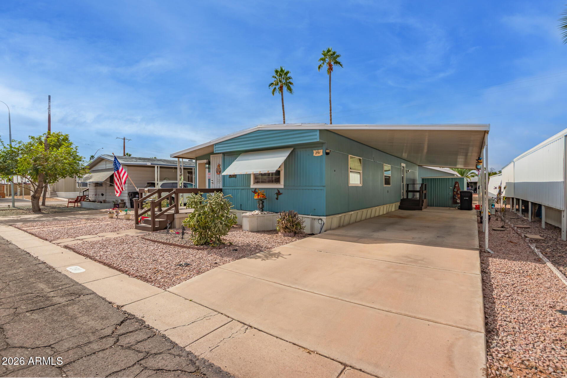 201 South Greenfield Road, Unit 291 Mesa, AZ 85206 - Photo 5 of 34 a front view of a house with a yard