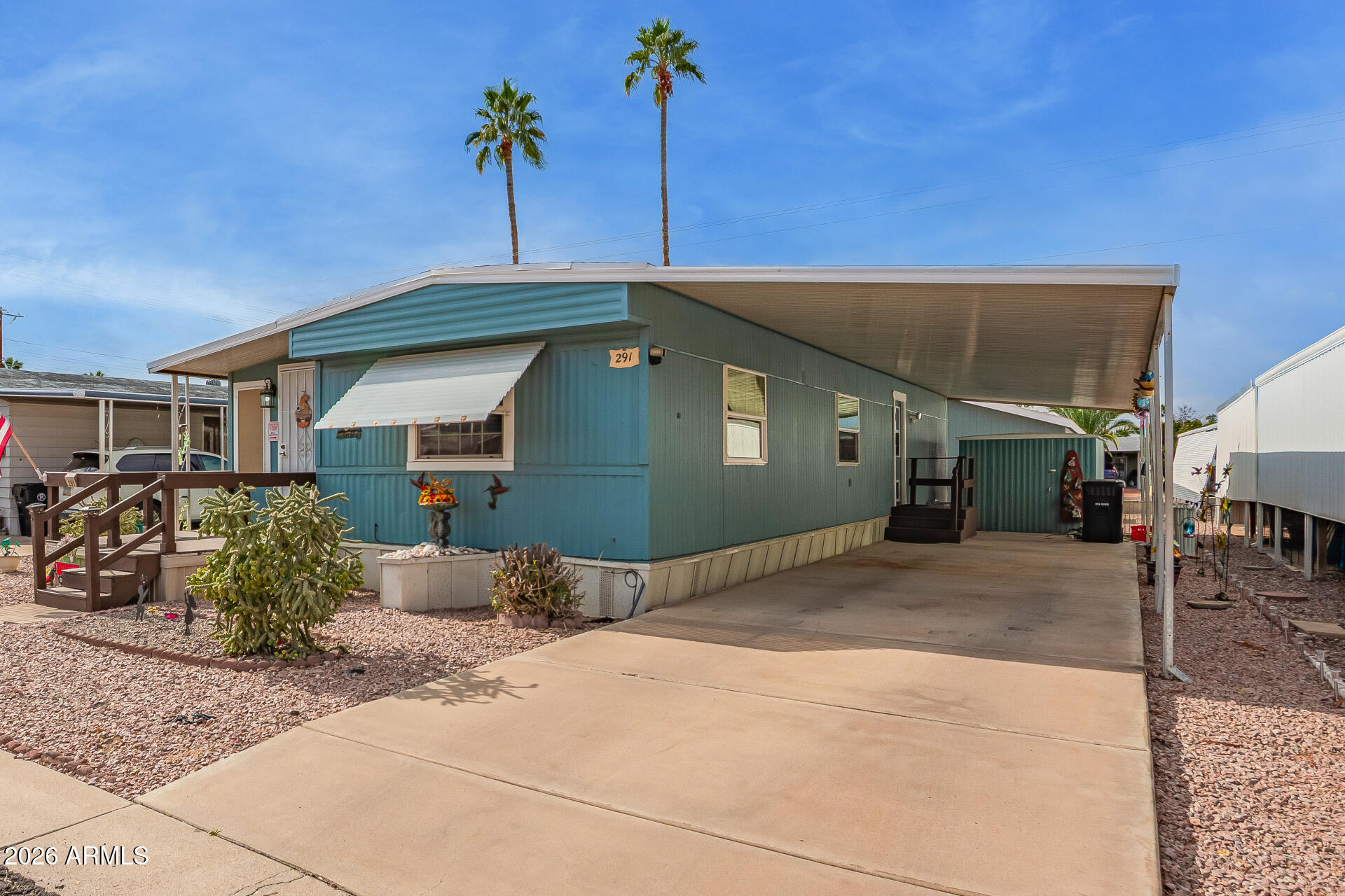 201 South Greenfield Road, Unit 291 Mesa, AZ 85206 - Photo 6 of 34 a front view of a house with a garage