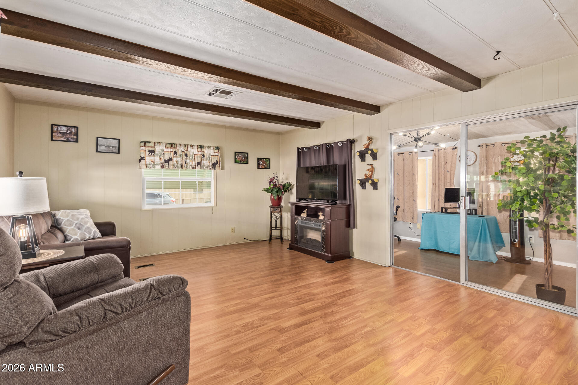 201 South Greenfield Road, Unit 291 Mesa, AZ 85206 - Photo 8 of 34 a living room with furniture and a flat screen tv