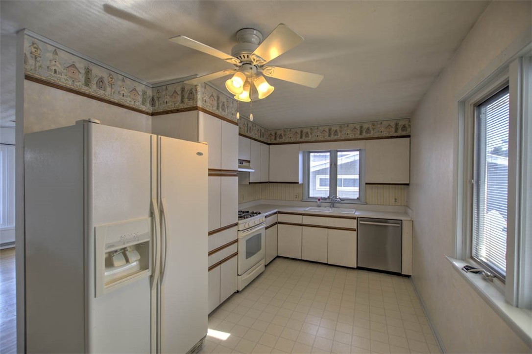 155 Columbus Drive Decatur, IL 62526 - Photo 10 of 30 a kitchen with a refrigerator and a sink