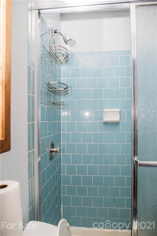 3307 Piney Grove Road Charlotte, NC 28212 - Photo 13 of 48 a bathroom with a shower