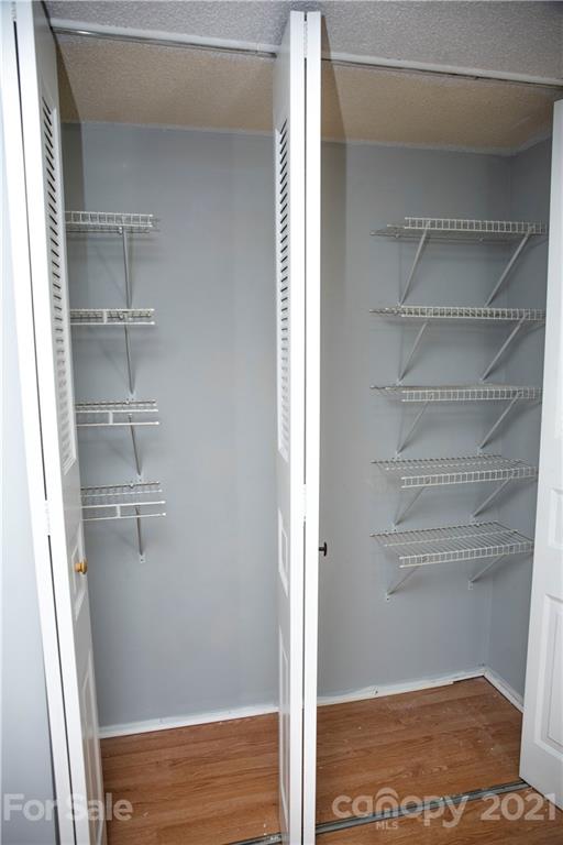 3307 Piney Grove Road Charlotte, NC 28212 - Photo 14 of 48 a view of walk in closet with empty racks