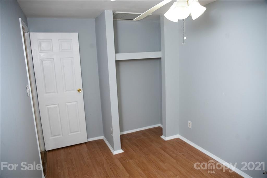 3307 Piney Grove Road Charlotte, NC 28212 - Photo 18 of 48 an empty room with wooden floor
