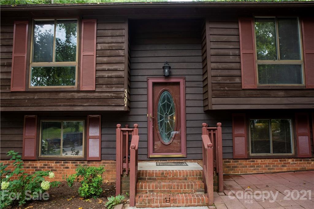 3307 Piney Grove Road Charlotte, NC 28212 - Photo 3 of 48 a front view of a house with a porch