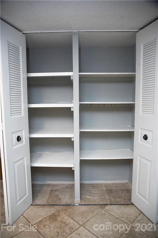 3307 Piney Grove Road Charlotte, NC 28212 - Photo 21 of 48 a view of walk in closet with empty racks