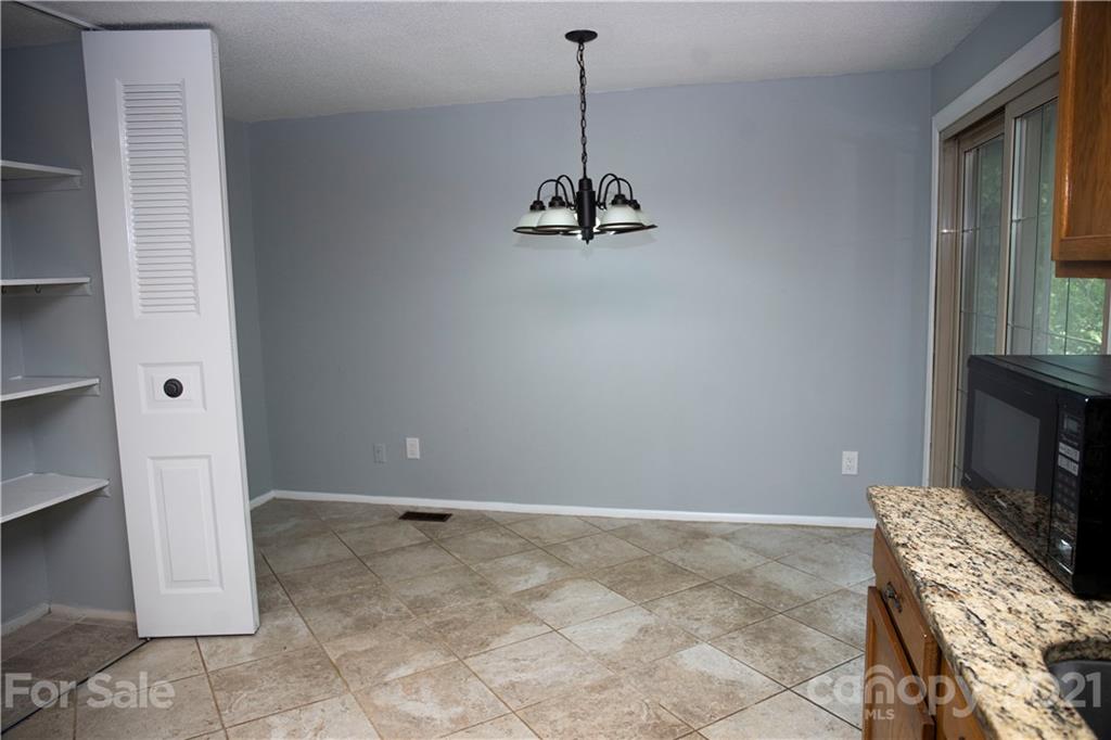 3307 Piney Grove Road Charlotte, NC 28212 - Photo 22 of 48 a view of a hallway with workspace