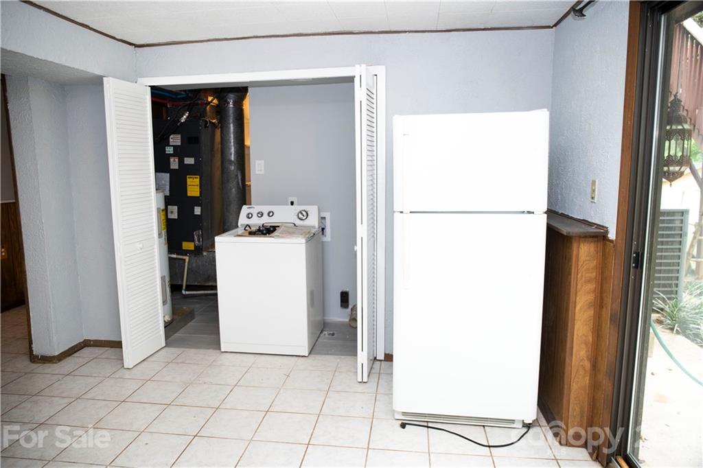 3307 Piney Grove Road Charlotte, NC 28212 - Photo 30 of 48 a utility room with washer and dryer