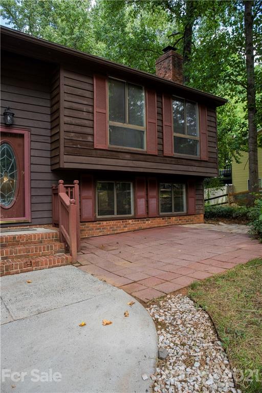 3307 Piney Grove Road Charlotte, NC 28212 - Photo 4 of 48 a front view of a house with a garden