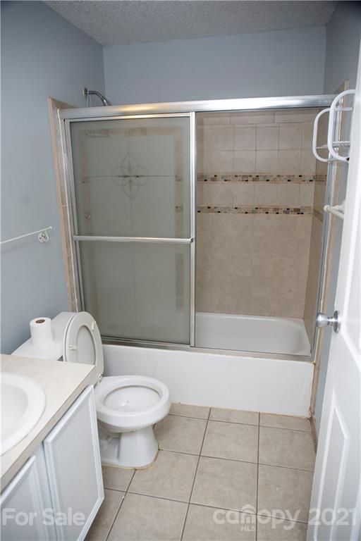 3307 Piney Grove Road Charlotte, NC 28212 - Photo 8 of 48 a bathroom with a toilet and a shower