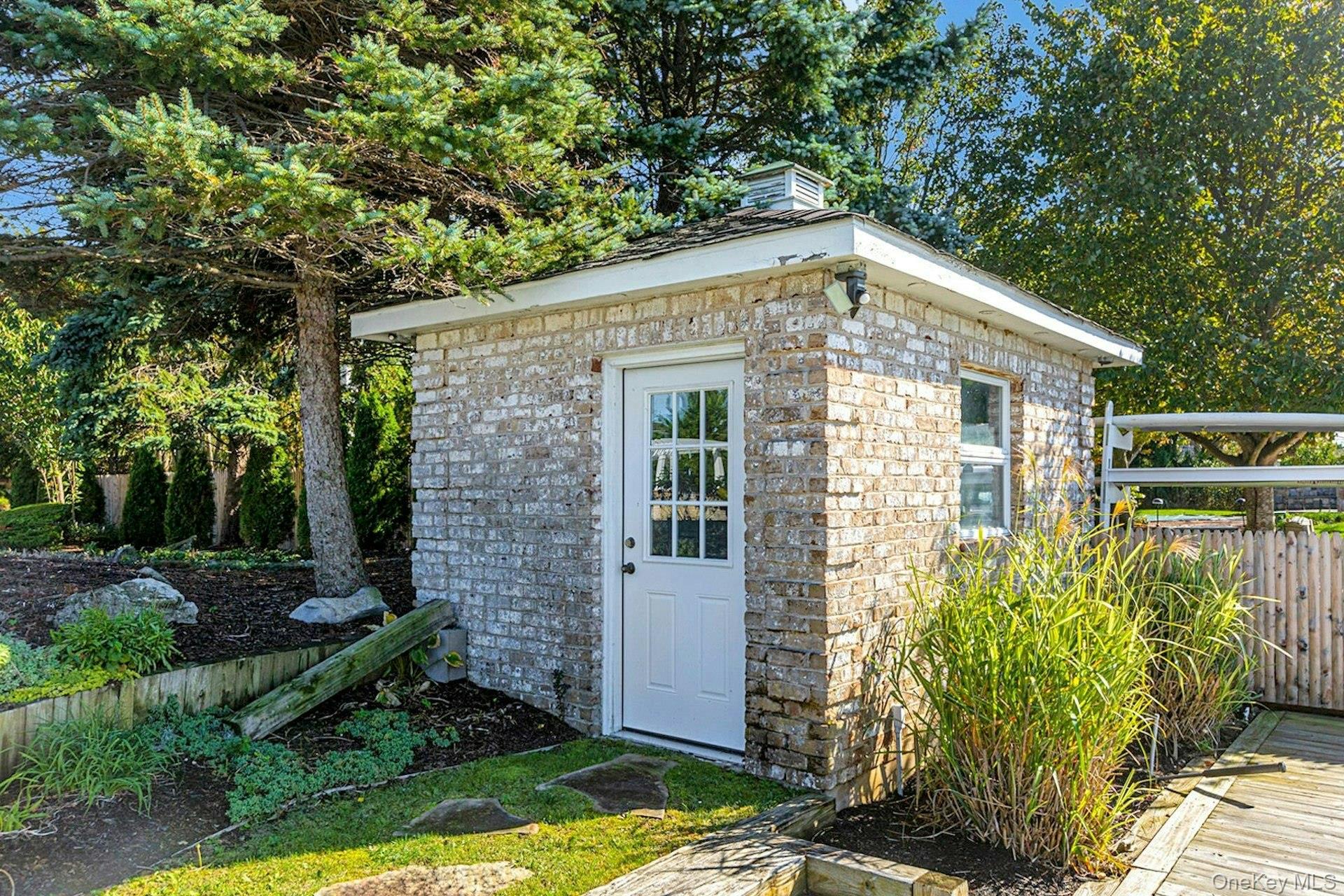 10 Beech Road Islip, NY 11751 - Photo 46 of 49 Brick storage shed for all of your outdoor items.
