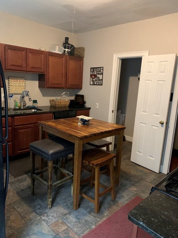 90 Fairfield Street Springfield, MA 01108 - Photo 8 of 9 a table and chairs in a kitchen