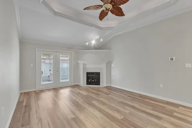 a view of an empty room and wooden floor