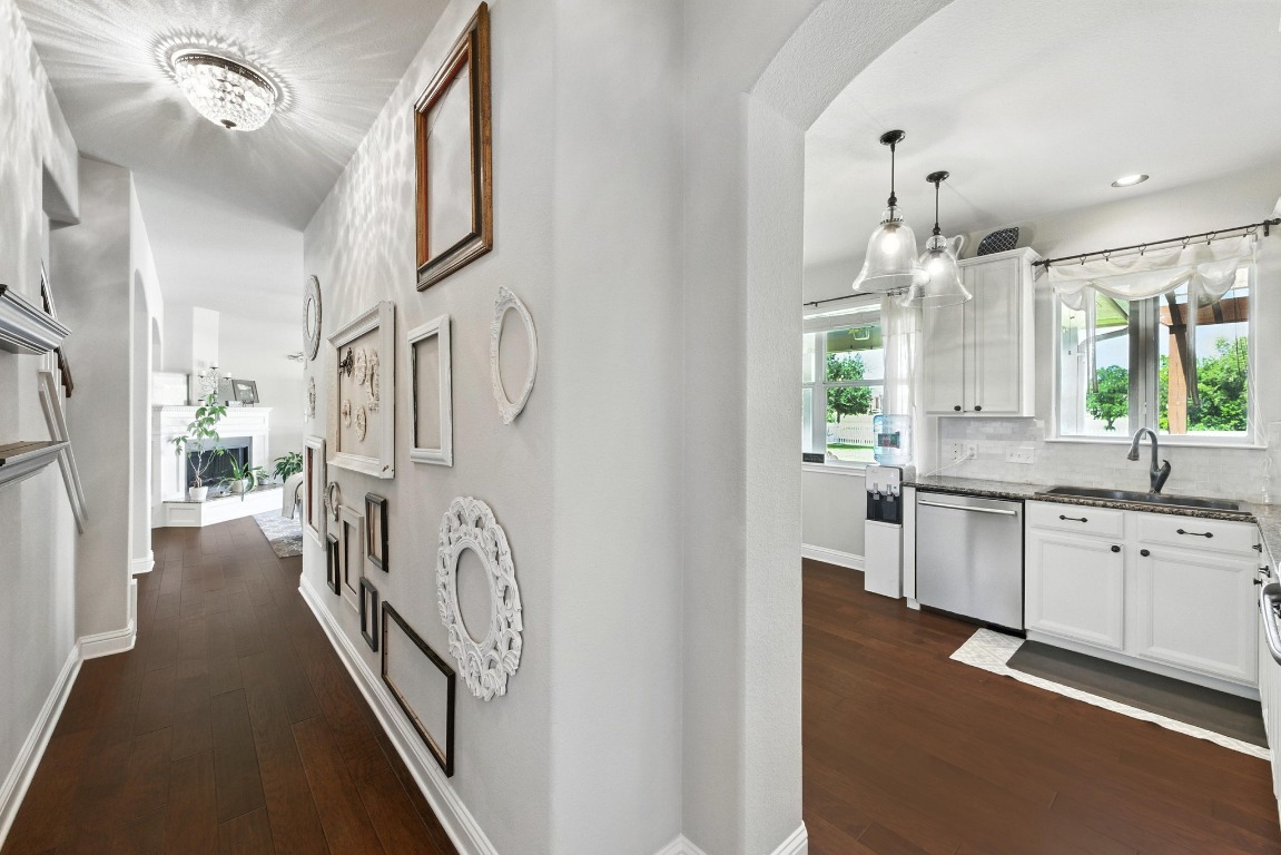 316 Caraway Kyle, TX 78640 - Photo 18 of 39 Hall featuring wood flooring, arched walkways, and custom pottery barn lighting
