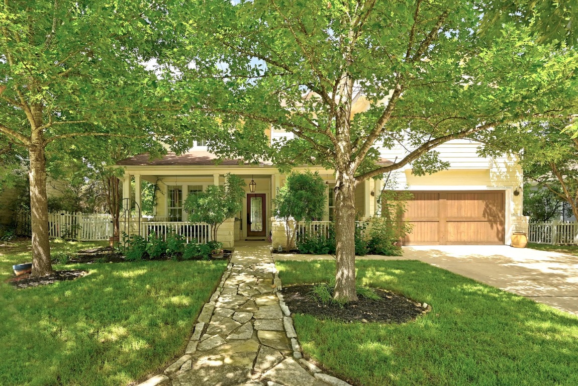 316 Caraway Kyle, TX 78640 - Photo 2 of 39 Mature trees, covered front porch and attached garage. Relax and unwind during sunset.