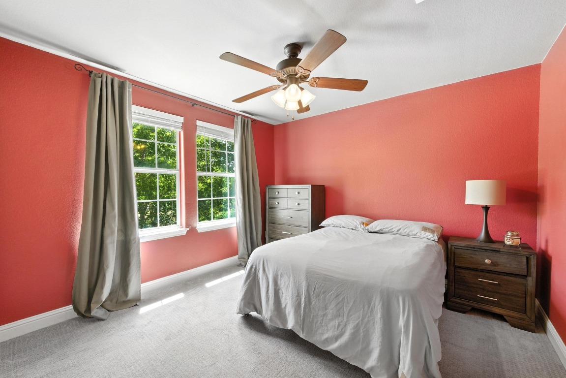 316 Caraway Kyle, TX 78640 - Photo 26 of 39 Large carpeted secondary bedroom with ceiling fan