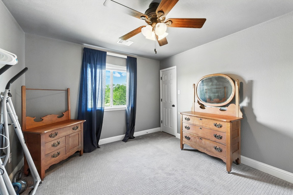316 Caraway Kyle, TX 78640 - Photo 29 of 39 Bedroom with light carpet and ceiling fan