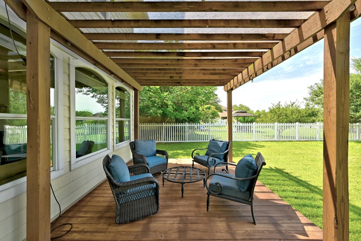 316 Caraway Kyle, TX 78640 - Photo 33 of 39 Wooden deck with pergola, a fenced backyard and outdoor lounge area