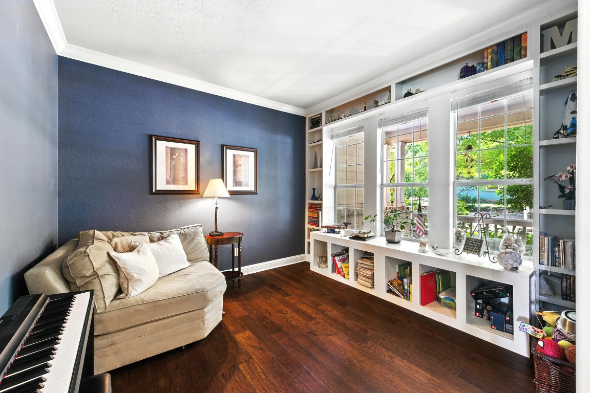 316 Caraway Kyle, TX 78640 - Photo 9 of 39 Sitting room with crown molding, wood finished floors, and built in features