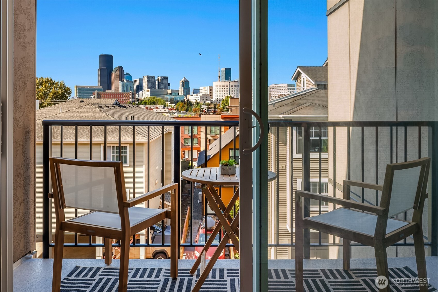 701 17th Avenue, Unit 305 Seattle, WA 98122 - Photo 11 of 36 a view of a balcony with furniture