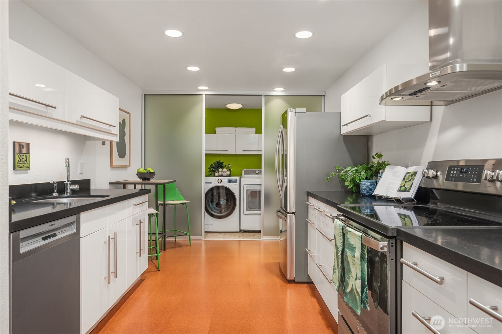 701 17th Avenue, Unit 305 Seattle, WA 98122 - Photo 13 of 36 a kitchen with a sink stove and cabinets