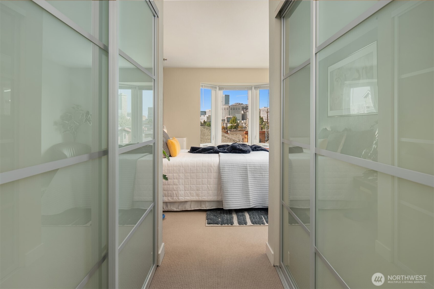 701 17th Avenue, Unit 305 Seattle, WA 98122 - Photo 20 of 36 a bedroom with a bed and with furniture