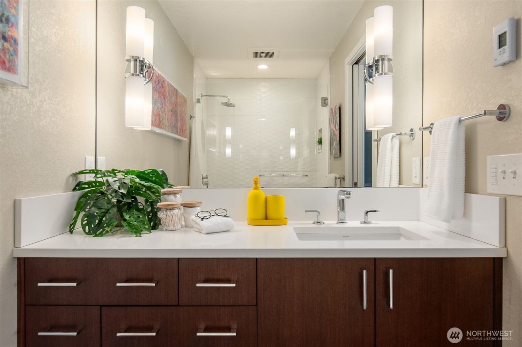 701 17th Avenue, Unit 305 Seattle, WA 98122 - Photo 23 of 36 a bathroom with a sink and a mirror