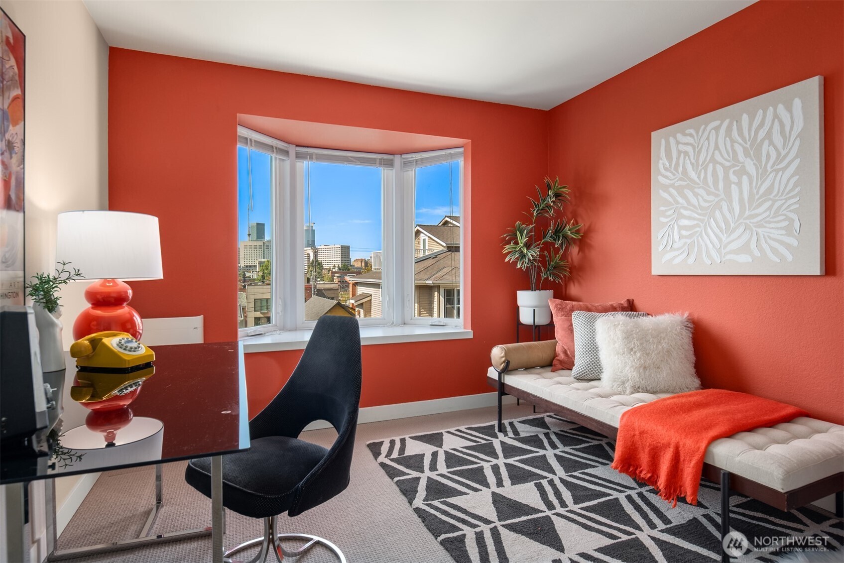 701 17th Avenue, Unit 305 Seattle, WA 98122 - Photo 24 of 36 a living room with furniture and a lamp