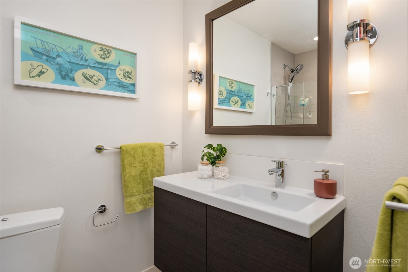 701 17th Avenue, Unit 305 Seattle, WA 98122 - Photo 26 of 36 a bathroom with a sink vanity and toilet