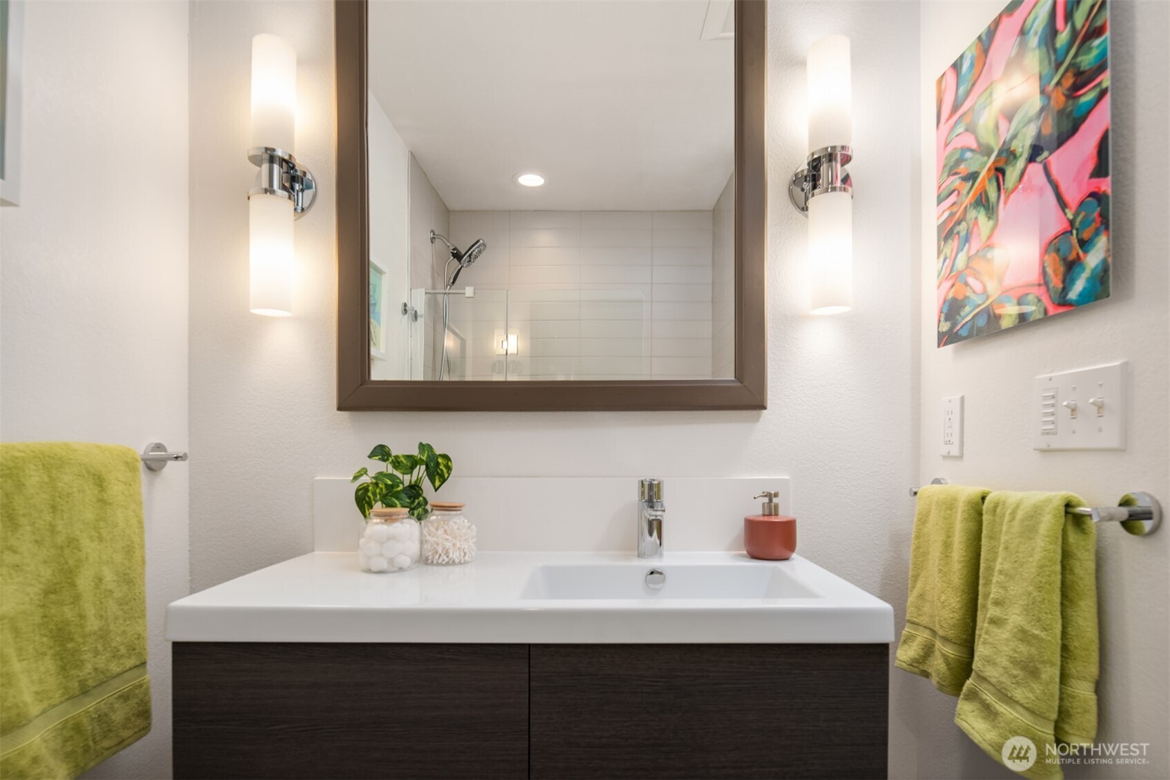 701 17th Avenue, Unit 305 Seattle, WA 98122 - Photo 27 of 36 a bathroom with a sink and a mirror