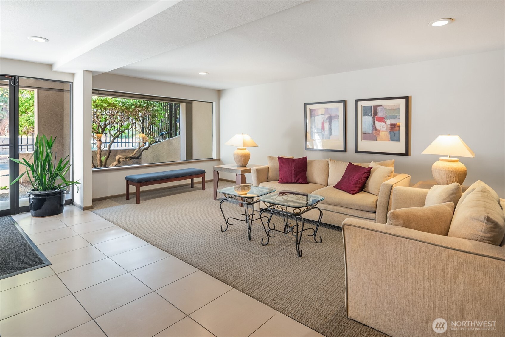 701 17th Avenue, Unit 305 Seattle, WA 98122 - Photo 32 of 36 a living room with furniture and a large window