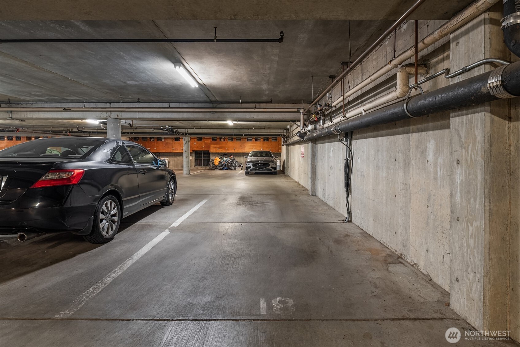 701 17th Avenue, Unit 305 Seattle, WA 98122 - Photo 33 of 36 a view of parking garage with cars