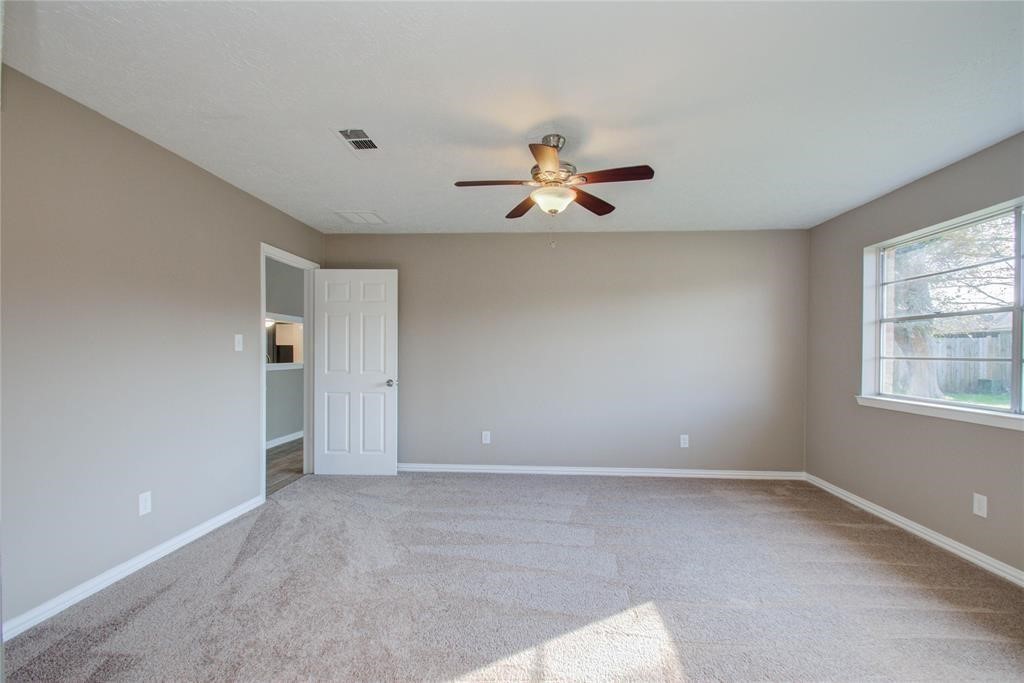 10510 Rancho Bernardo Lane Sugar Land, TX 77498 - Photo 16 of 27 a view of room with a ceiling fan and window
