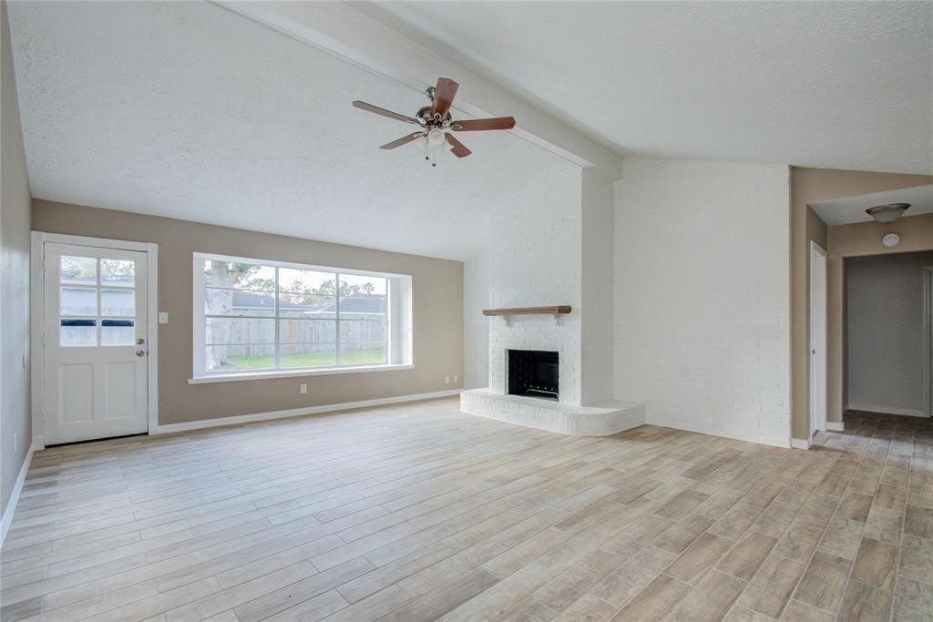 10510 Rancho Bernardo Lane Sugar Land, TX 77498 - Photo 5 of 27 a view of empty room with wooden floor and fan