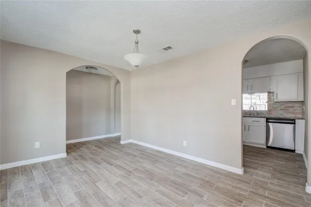 a view of a kitchen cabinets and wooden floor