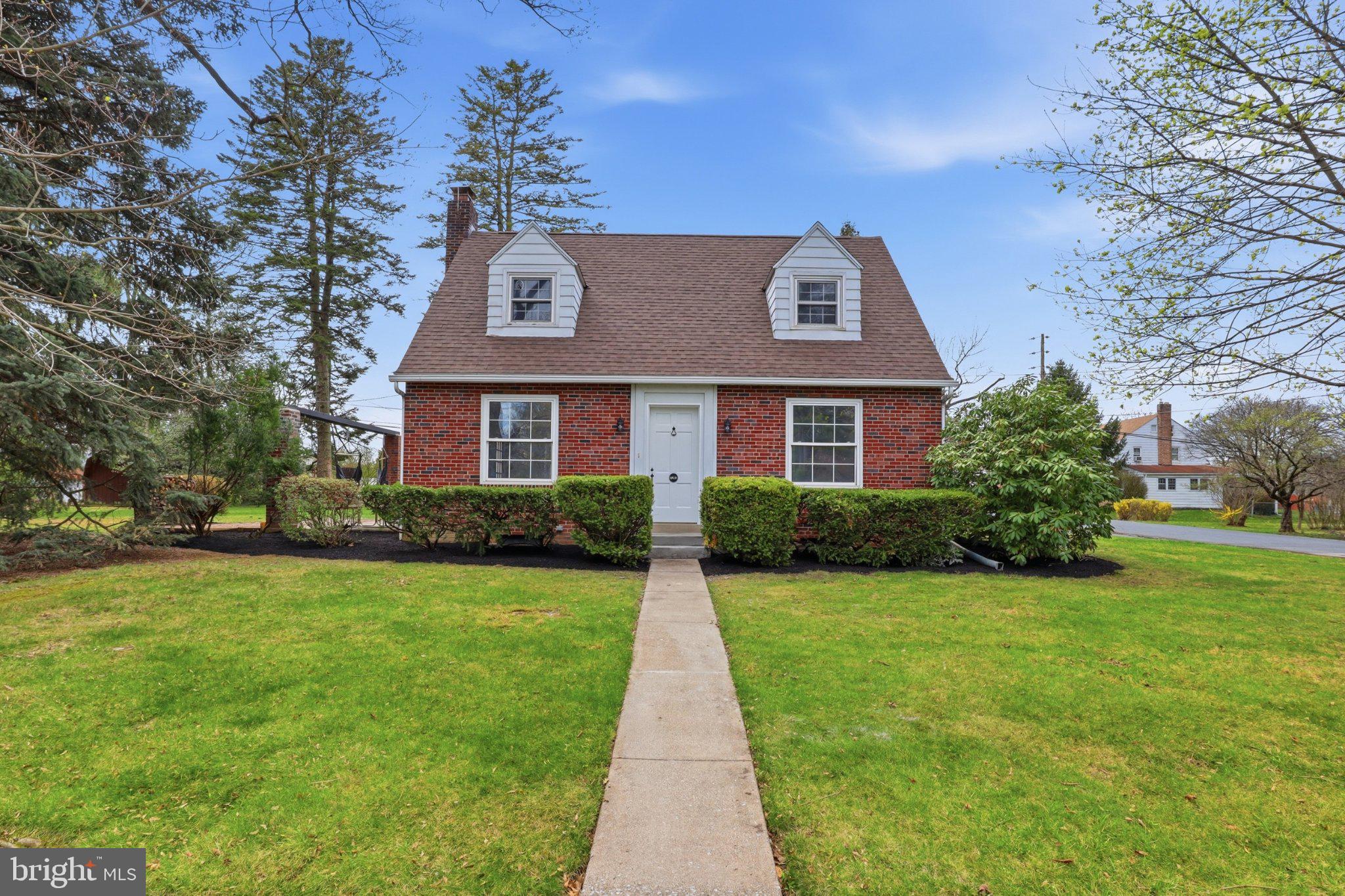 120 Maple Road Harrisburg, PA 17109 - Photo 2 of 53 Charming brick home with lush greenery.