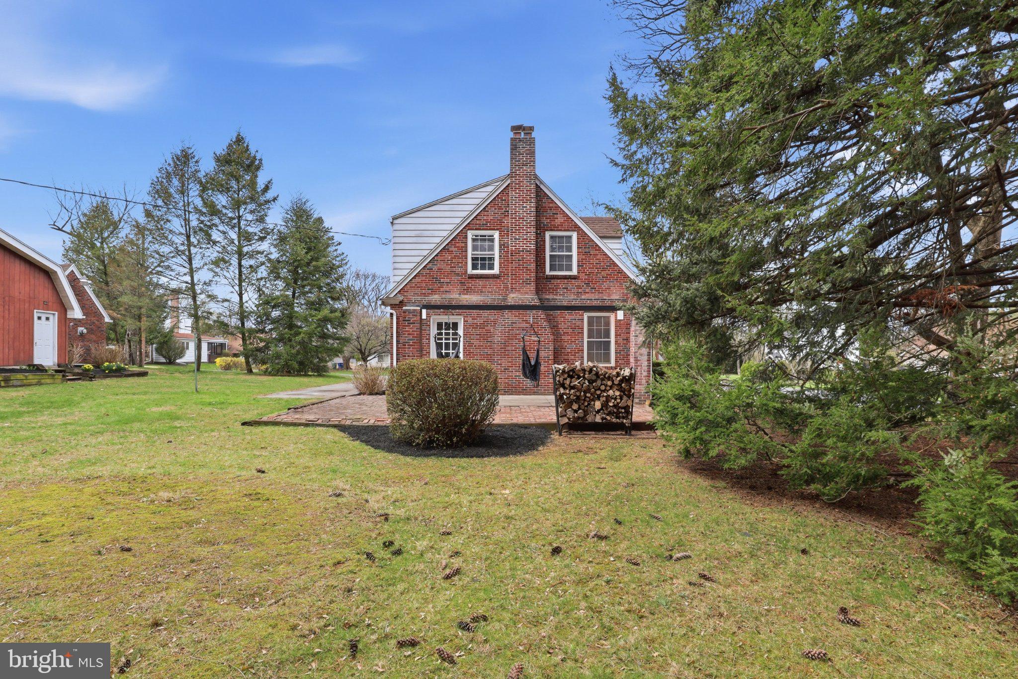 120 Maple Road Harrisburg, PA 17109 - Photo 33 of 53 Charming brick home with lush greenery.