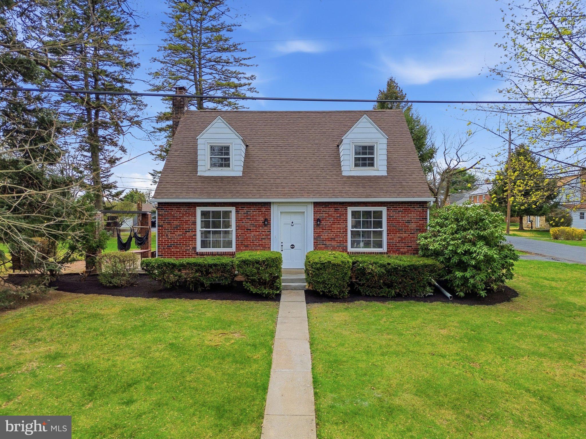 120 Maple Road Harrisburg, PA 17109 - Photo 38 of 53 Charming brick home with lush greenery.