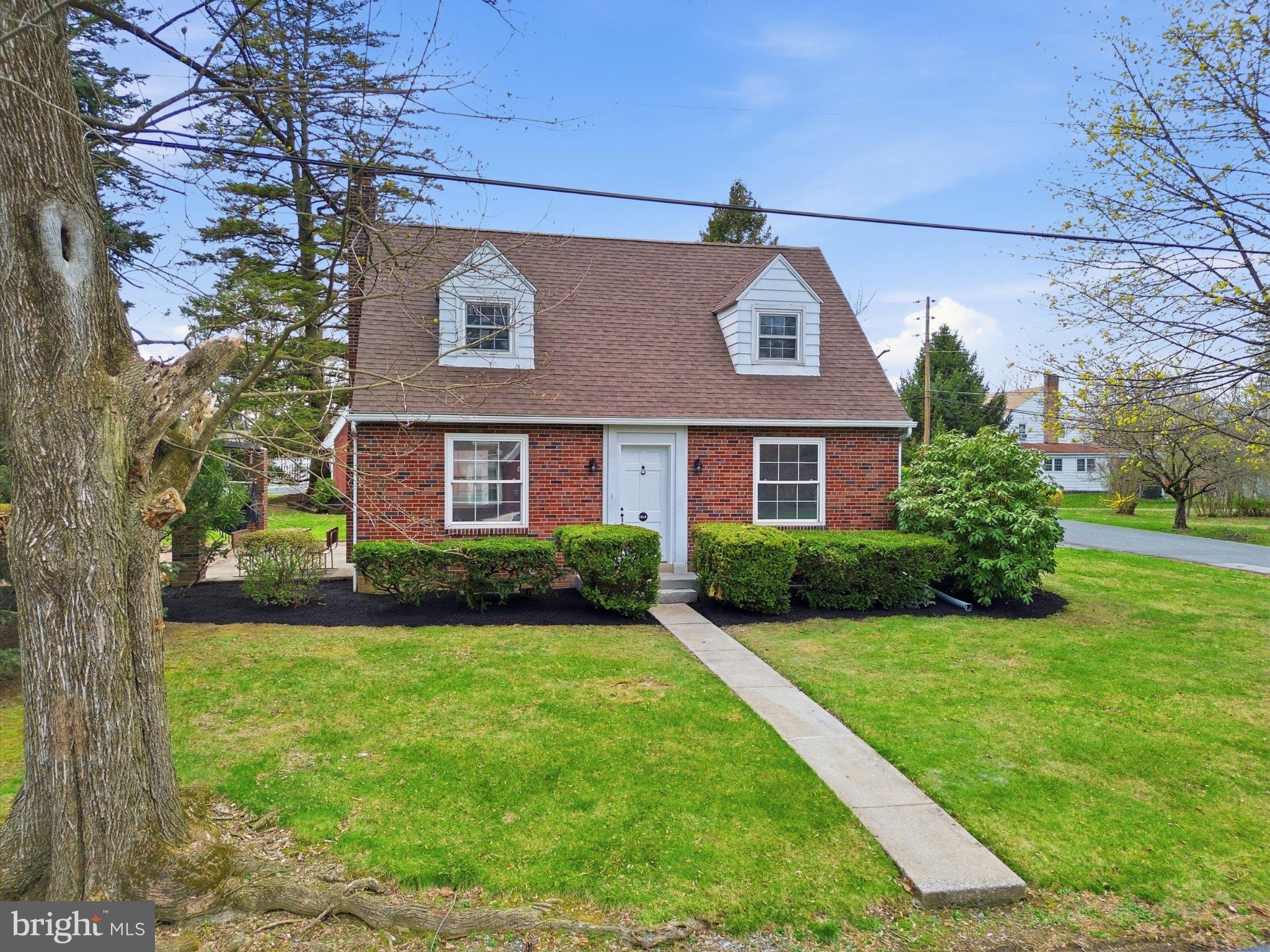 120 Maple Road Harrisburg, PA 17109 - Photo 39 of 53 Charming brick home with lush greenery.