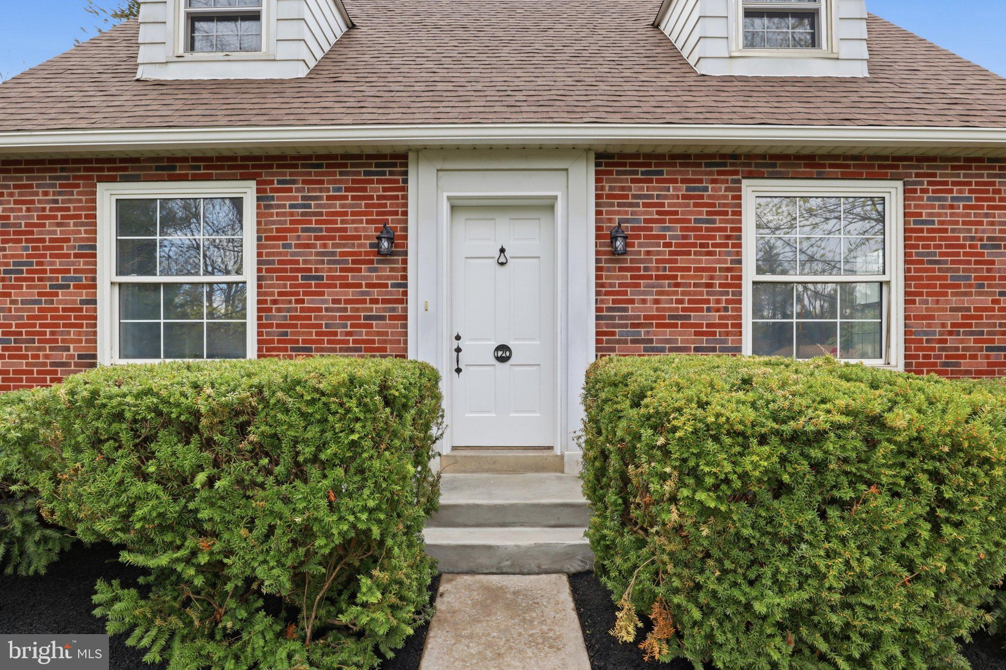 120 Maple Road Harrisburg, PA 17109 - Photo 5 of 53 Charming brick facade with lush greenery.