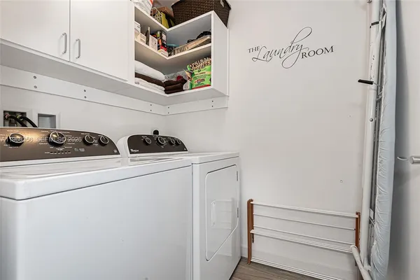 a utility room with dryer and washer